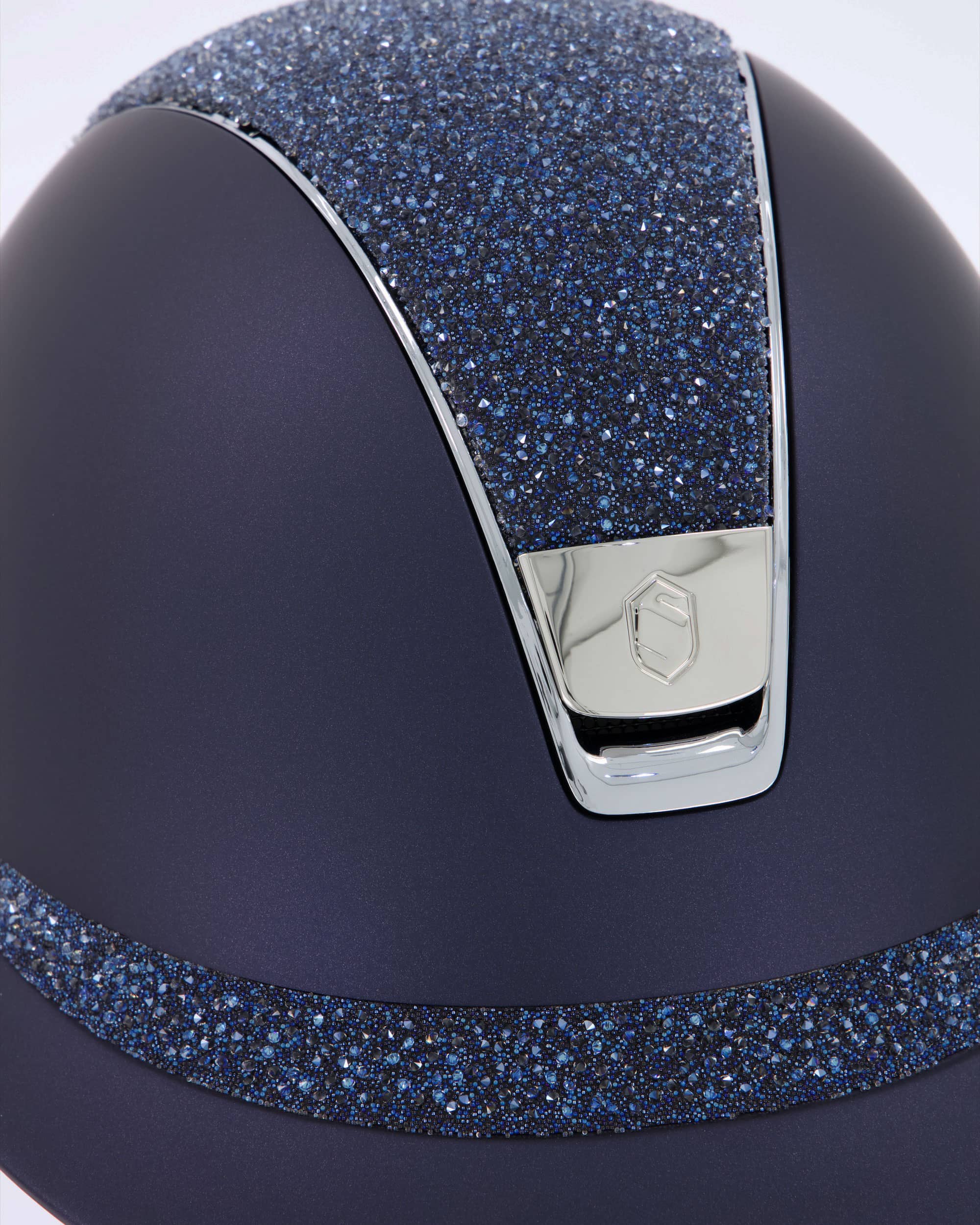 Riding helmet Miss Shield Shadowmatt, Top Crystal Fine Medley Swarovski Moonlight, Frontal Band Crystal Fine Medley Swarovski Moonlight, Trim Chrome Silver, Blason Chrome Silver in blue