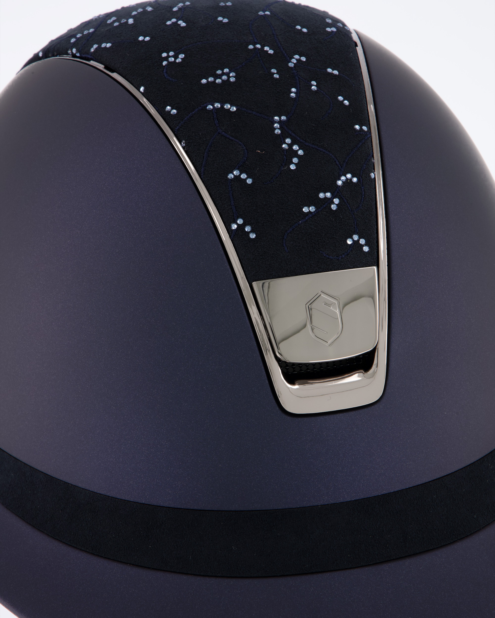 Riding helmet Miss Shield Shadowmatt Blue, Top Crystal Leaf Blue / Alcantara Blue, Frontal Band Alcantara Blue, Trim Chrome Black, Blason Chrome Black in blue
