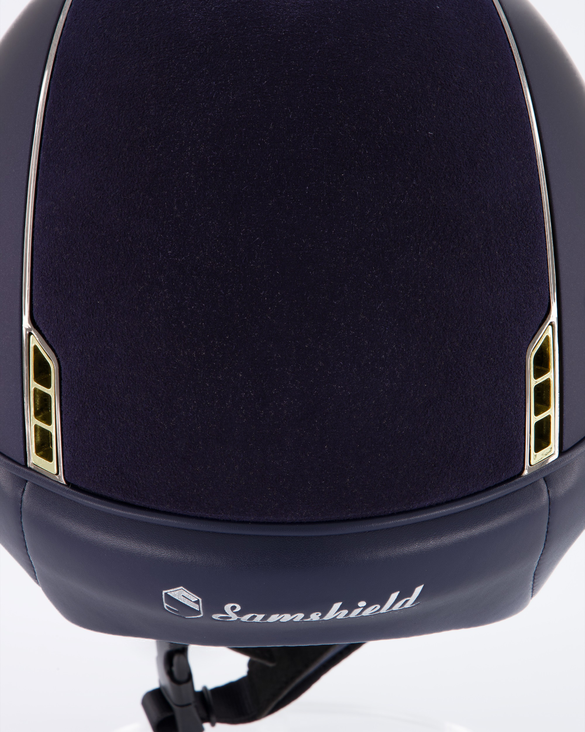 Riding helmet Miss Shield Shadowmatt Blue, Top Alcantara Blue, Frontal Band Crystal Fabric Swarovski Metal Eclipse, Trim Chrome Black, Blason Crystal Fabric Gold