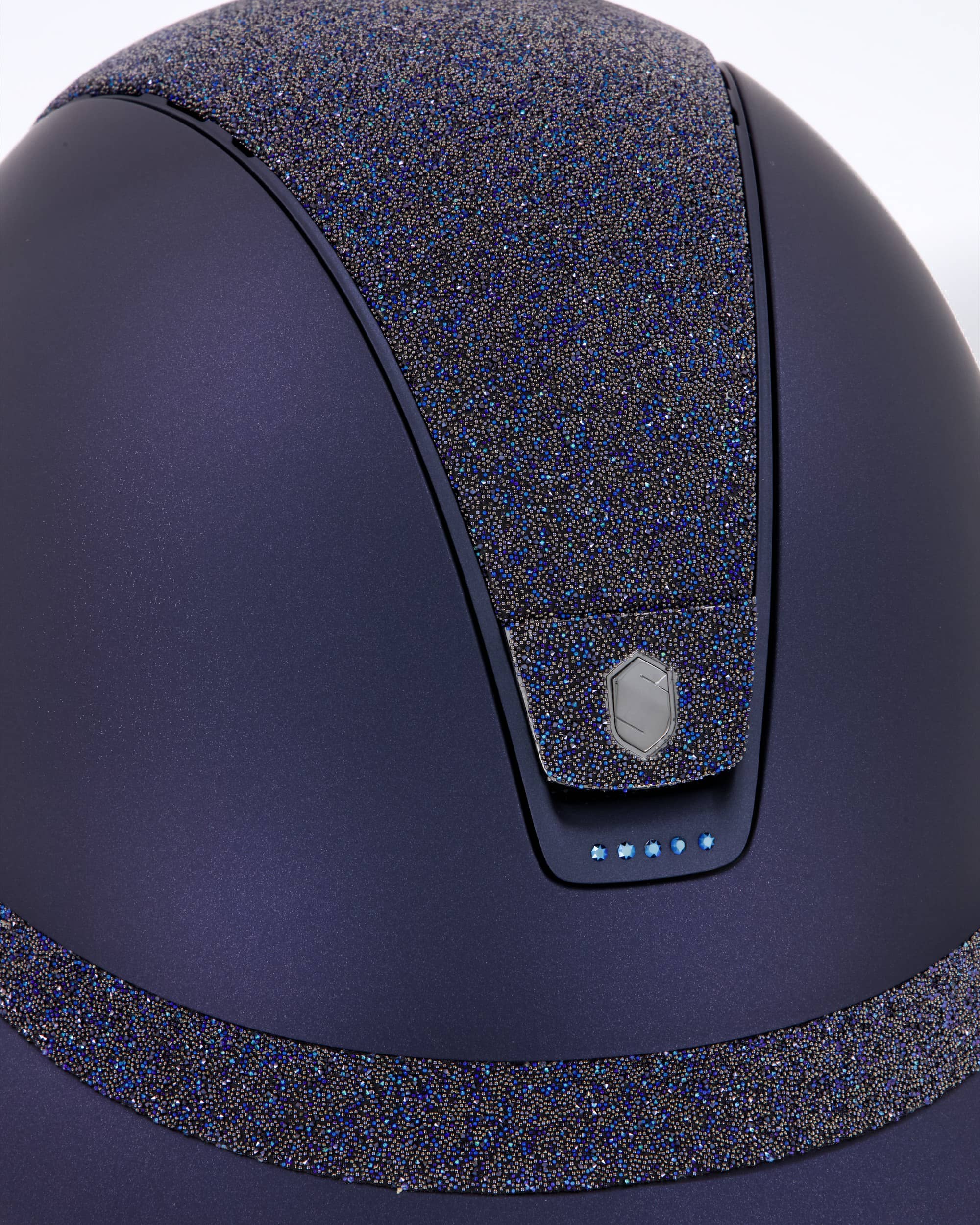 Riding helmet Miss Shield Shadowmatt Blue, Top Crystal Fabric Swarovski bermuda blue, Frontal Band Crystal Fabric Swarovski Bermuda blue, trim Matt navy blue, Swarovski metal blue, Blason Crystal Fabric bermuda blue