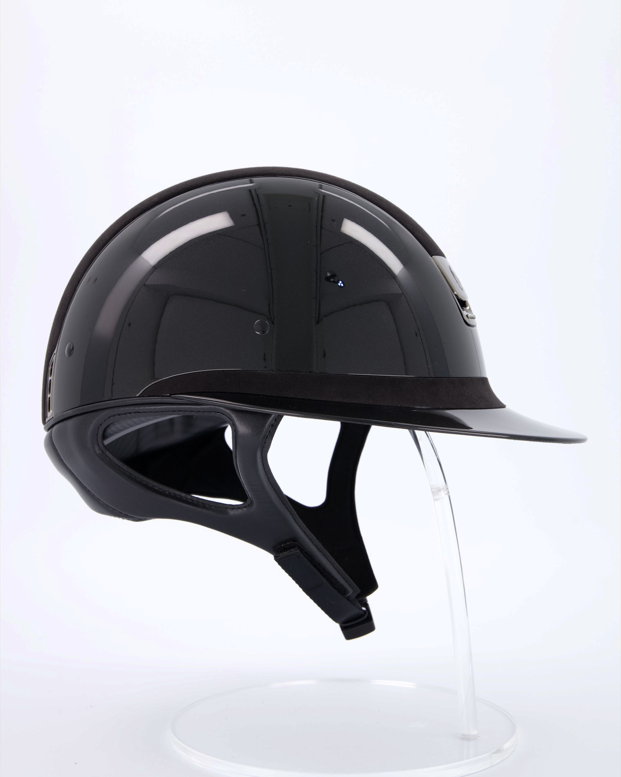 Riding helmet Miss Shield Shadowglossy Black, Top and frontal band Alcantara Black, Trim Matt Black, Blason Chrome Black, 5 Swarovski stones Black