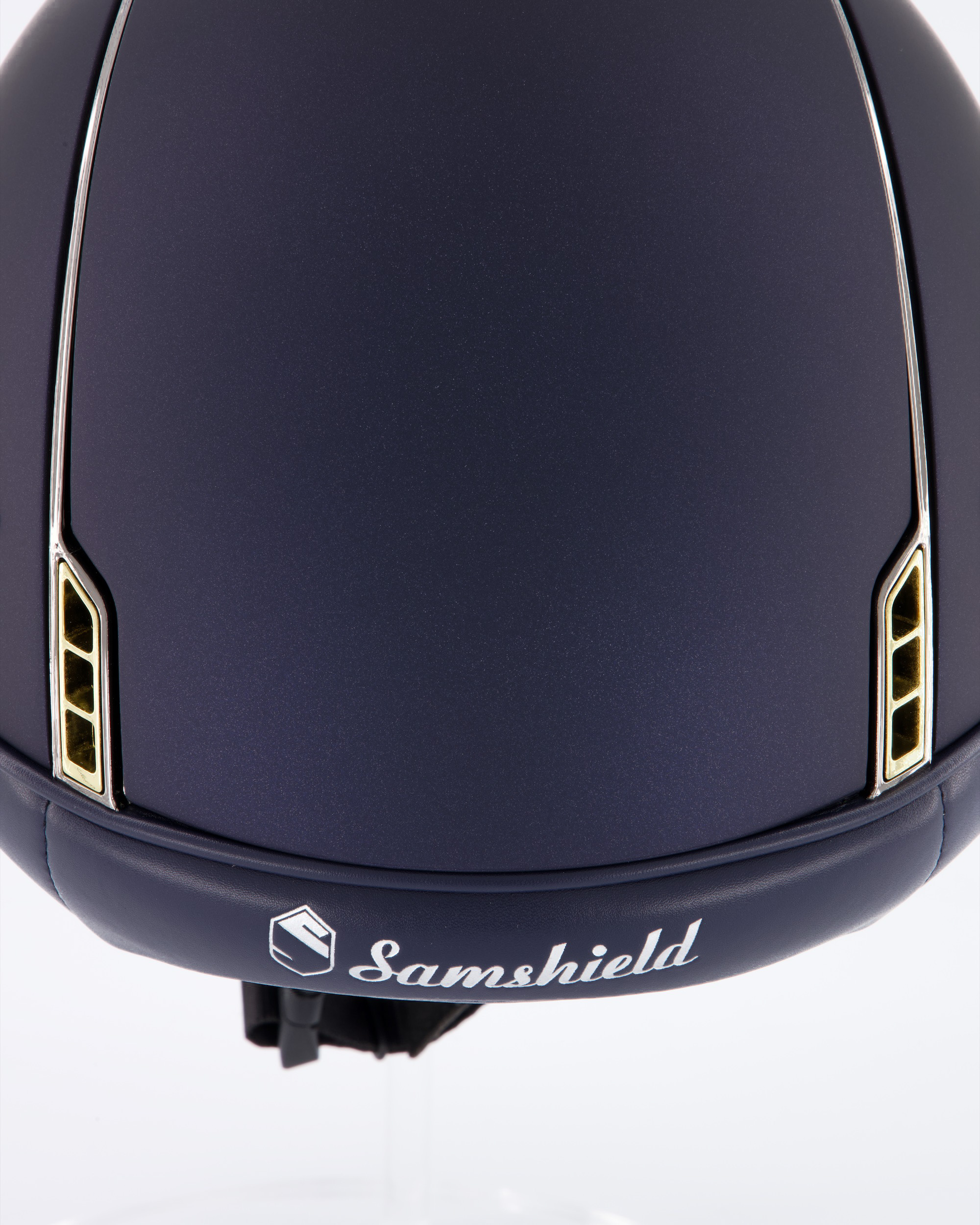 Riding helmet Miss Shield Shadowmatt Blue, Top Shadowmatt blue, Frontal Band Crystal fabric Swarovski Metal Eclipse, Trim Chrome Black, Blason Crystal Fabric Gold
