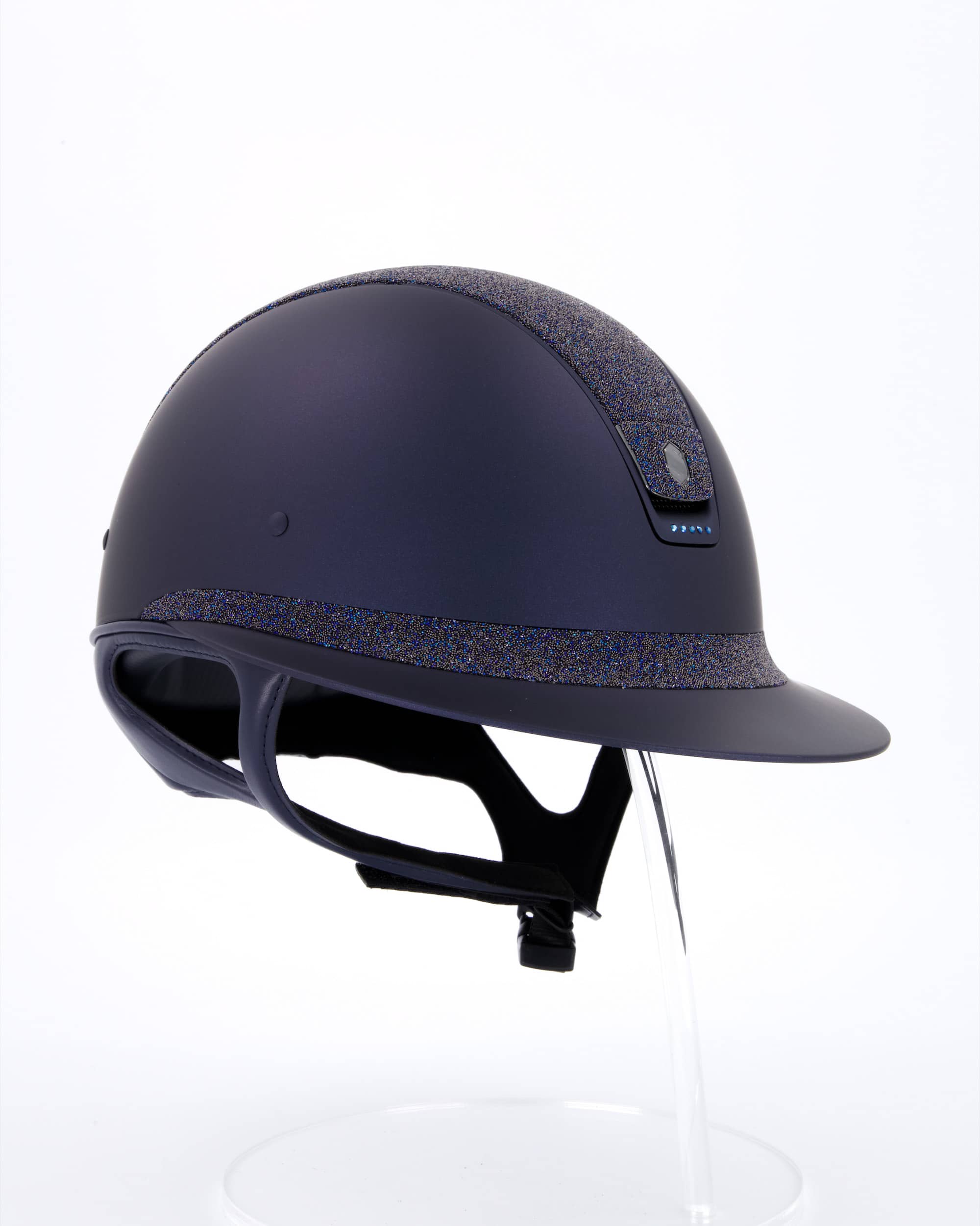Riding helmet Miss Shield Shadowmatt Blue, Top Crystal Fabric Swarovski bermuda blue, Frontal Band Crystal Fabric Swarovski Bermuda blue, trim Matt navy blue, Swarovski metal blue, Blason Crystal Fabric bermuda blue