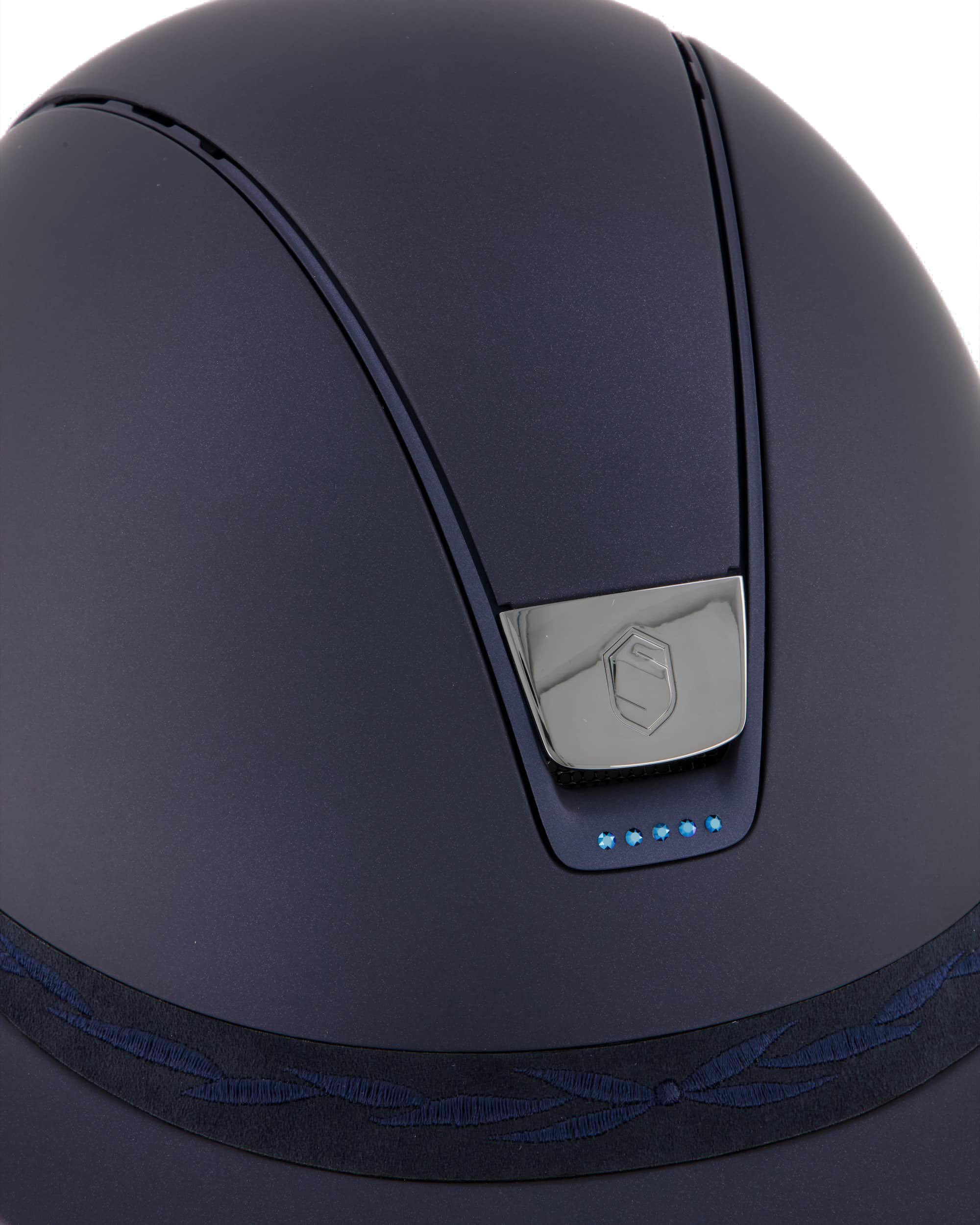 Riding helmet Miss Shield Shadowmatt Blue, Top Shadowmatt Blue, Frontal Band Flower Embroidery Blue, Trim Matt Navy Blue, 5 Swarovski Dark Blue, Blason Chrome Black