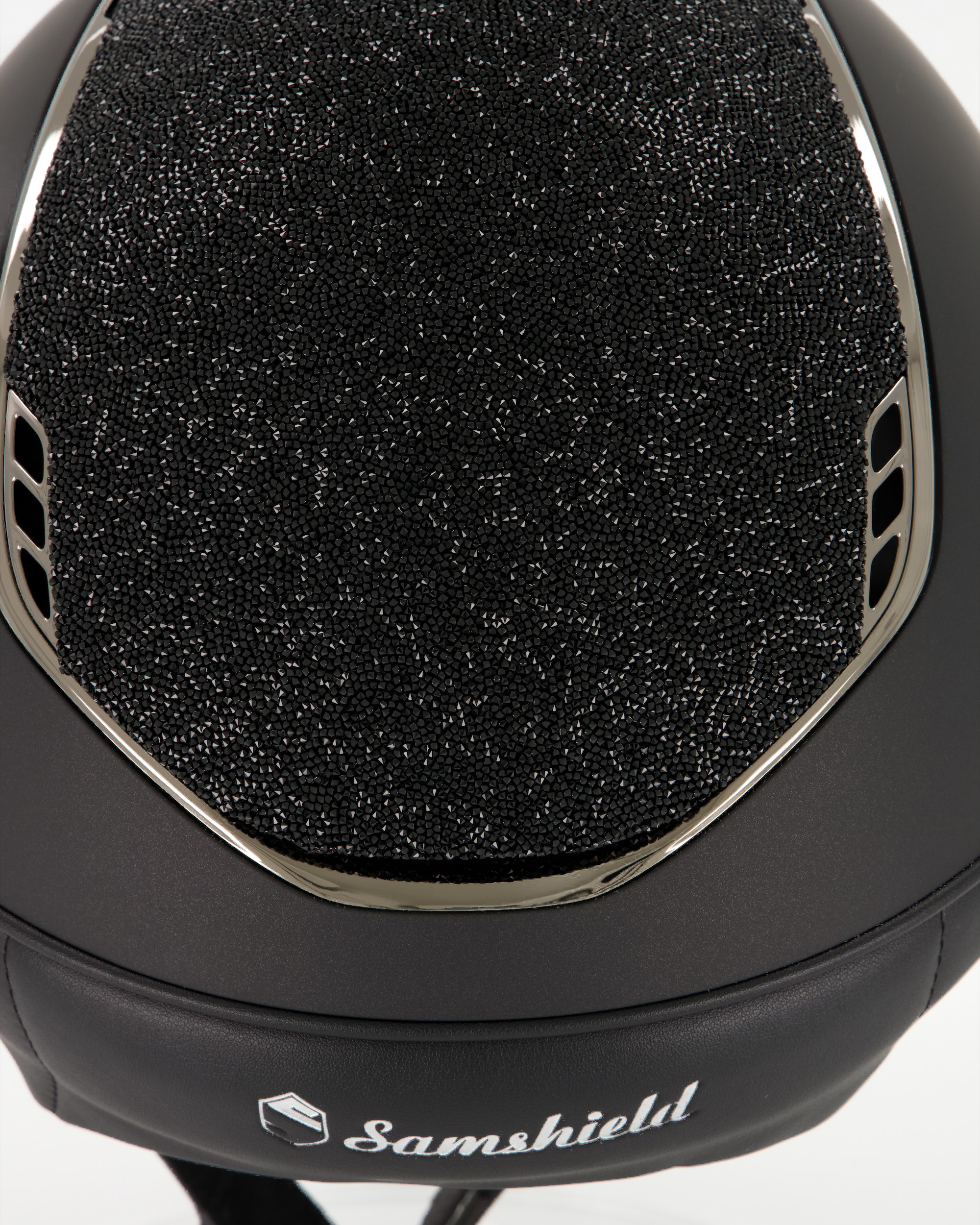 Riding helmet 2.0 Miss Shield Shadowmatt Black, Top and front strap Ultra Fine Rock, Trim and Blason Chrome Black in black