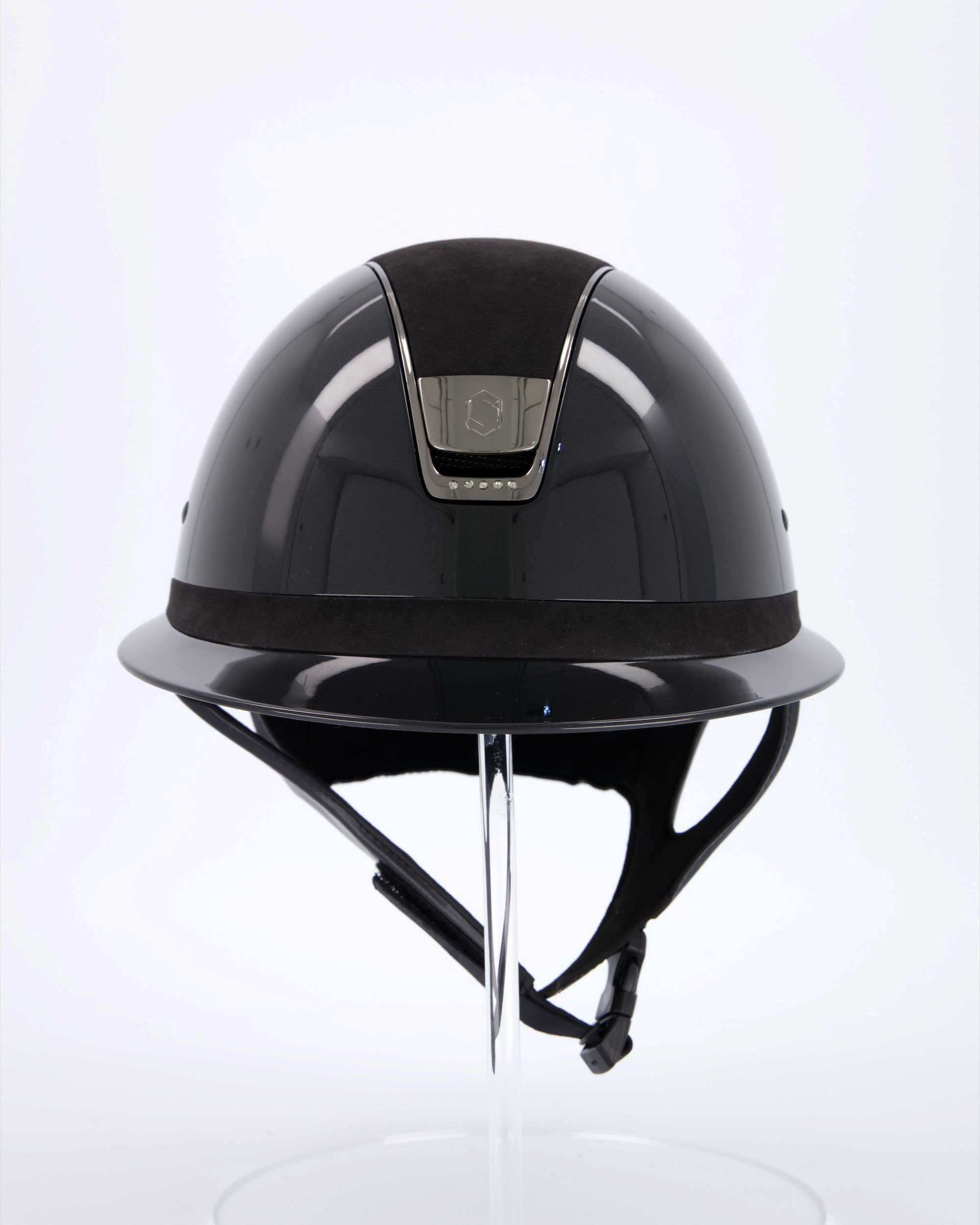 Riding helmet Miss Shield Shadowglossy Black, Top and frontal band Alcantara Black, Trim Matt Black, Blason Chrome Black, 5 Swarovski stones Black