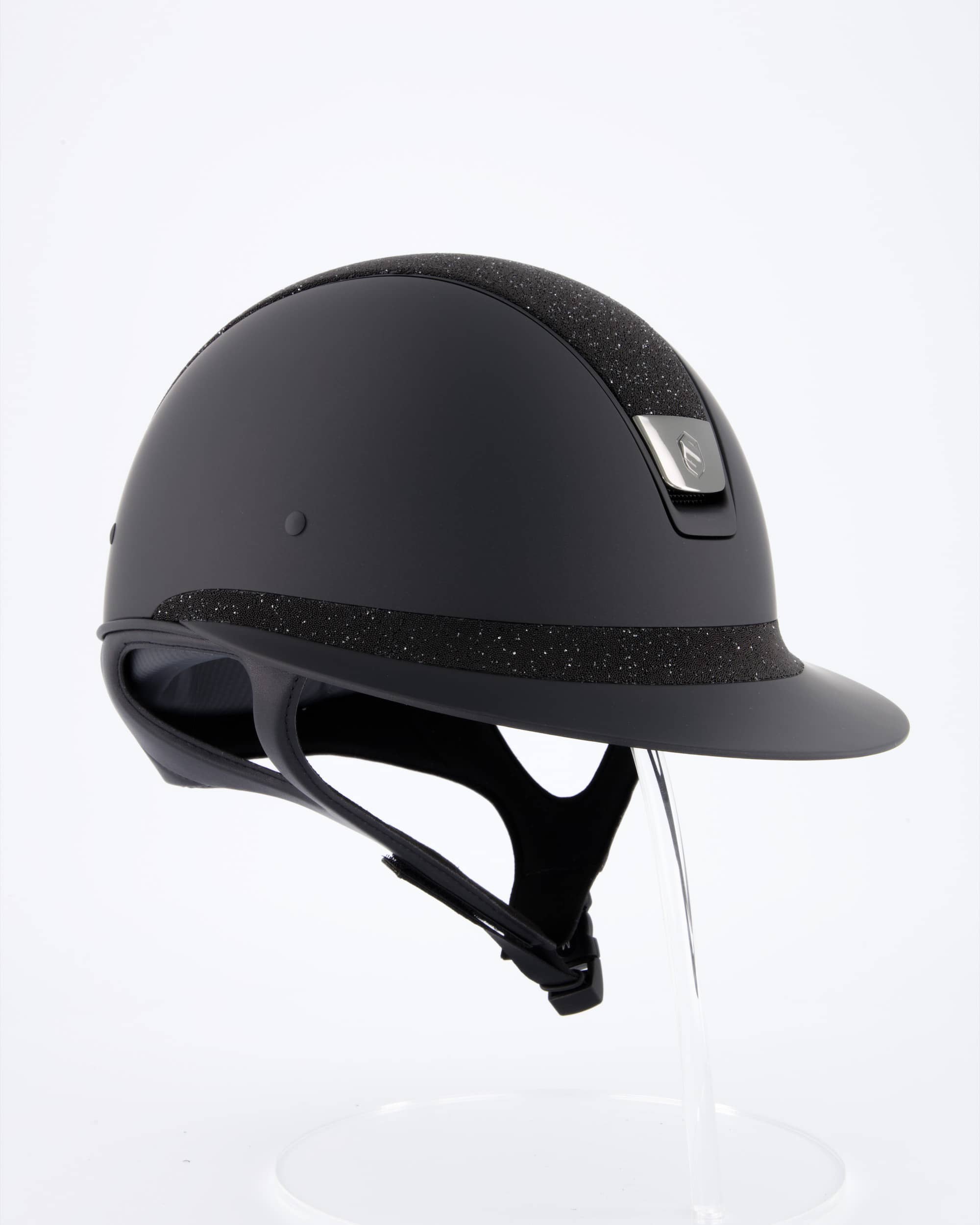 Riding helmet Miss Shield Shadowmatt, Top Crystal Fabric Swarovski Black, Frontal Band Crystal Fabric Swarovski Black, Trim Matt Black, Blason Chrome Black in black