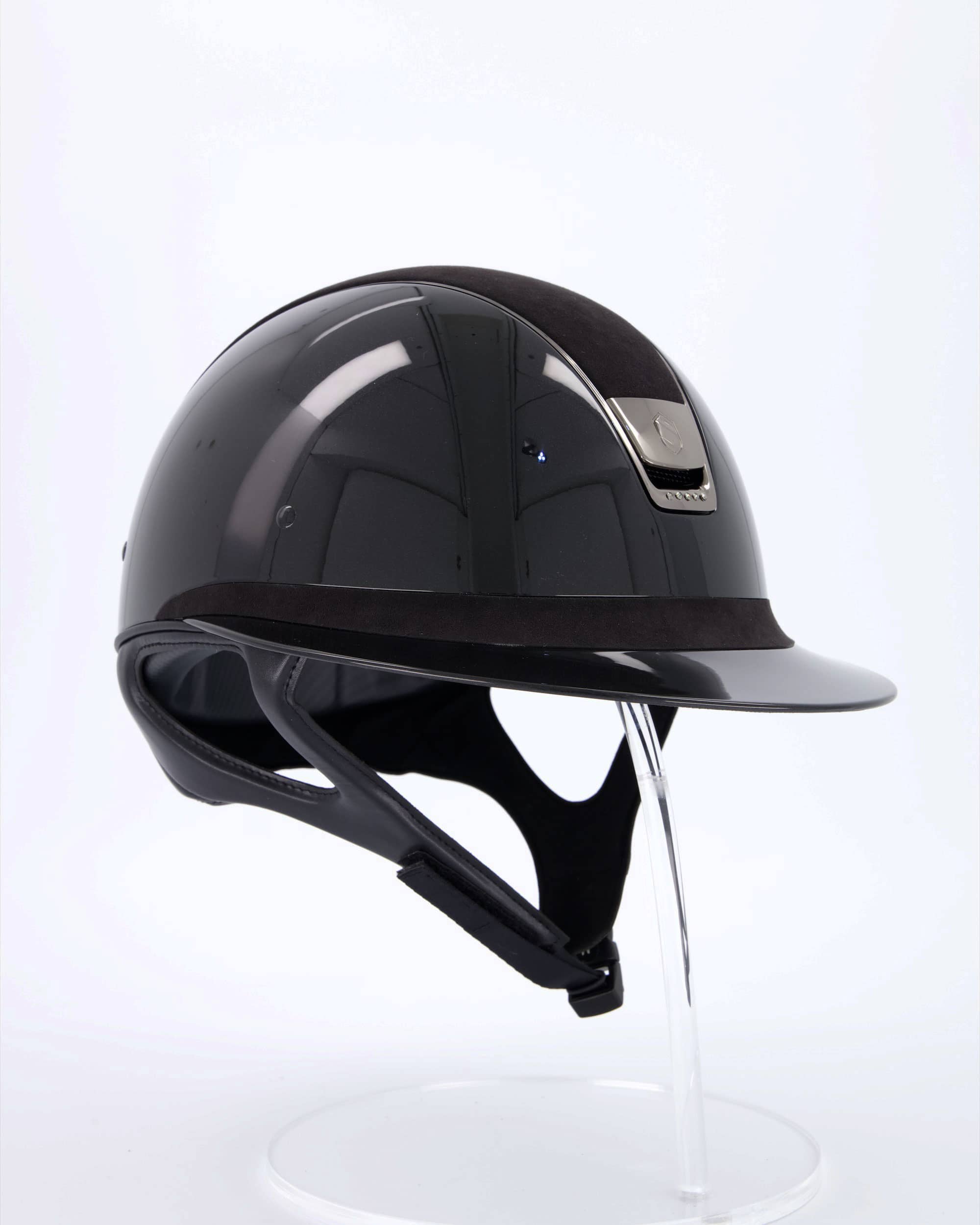 Riding helmet Miss Shield Shadowglossy Black, Top and frontal band Alcantara Black, Trim Matt Black, Blason Chrome Black, 5 Swarovski stones Black