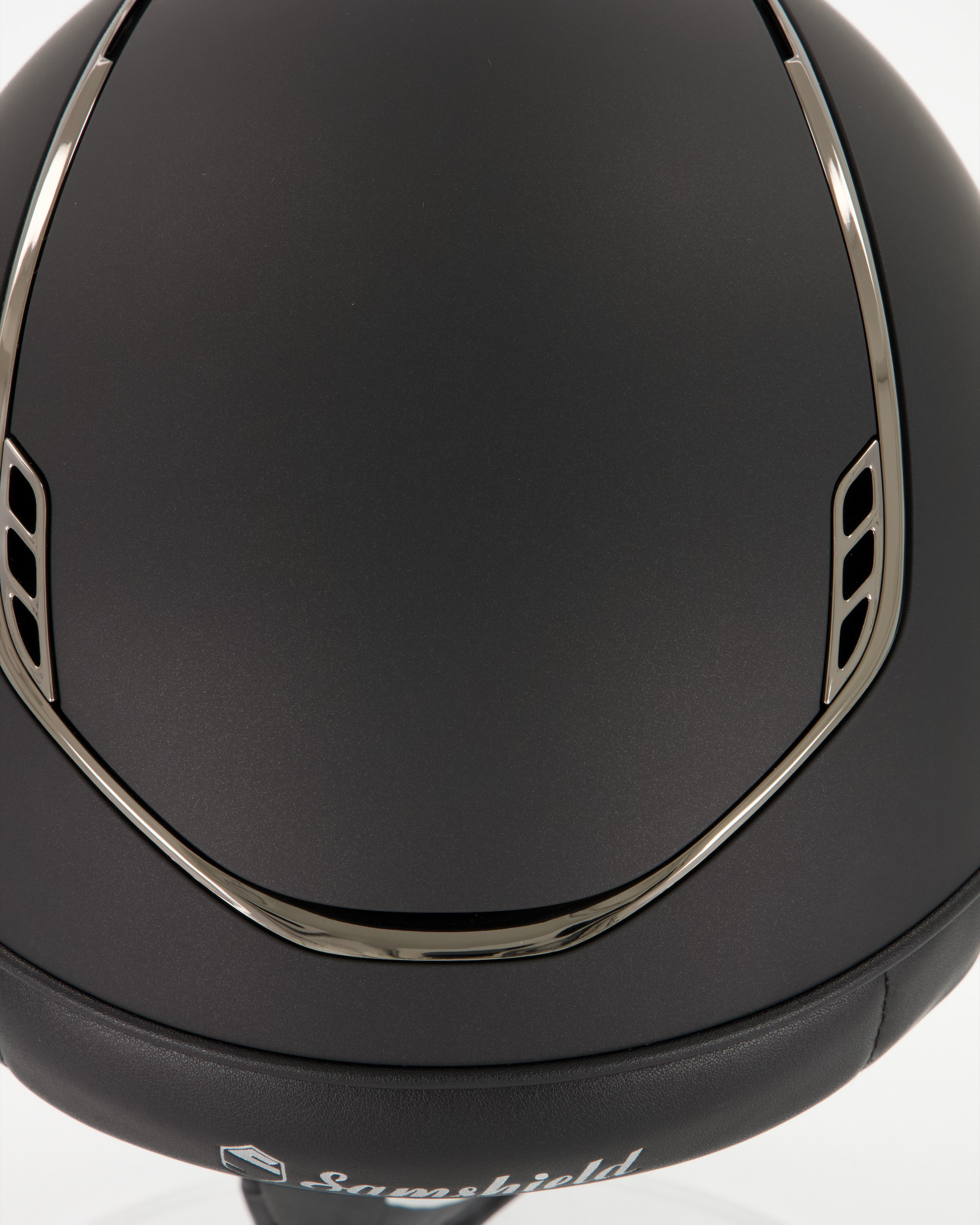Riding helmet 2.0 Miss Shield Shadowmatt,Frontal Band Crystal Fabric Black, Trim u. Blason Chrome Black in black