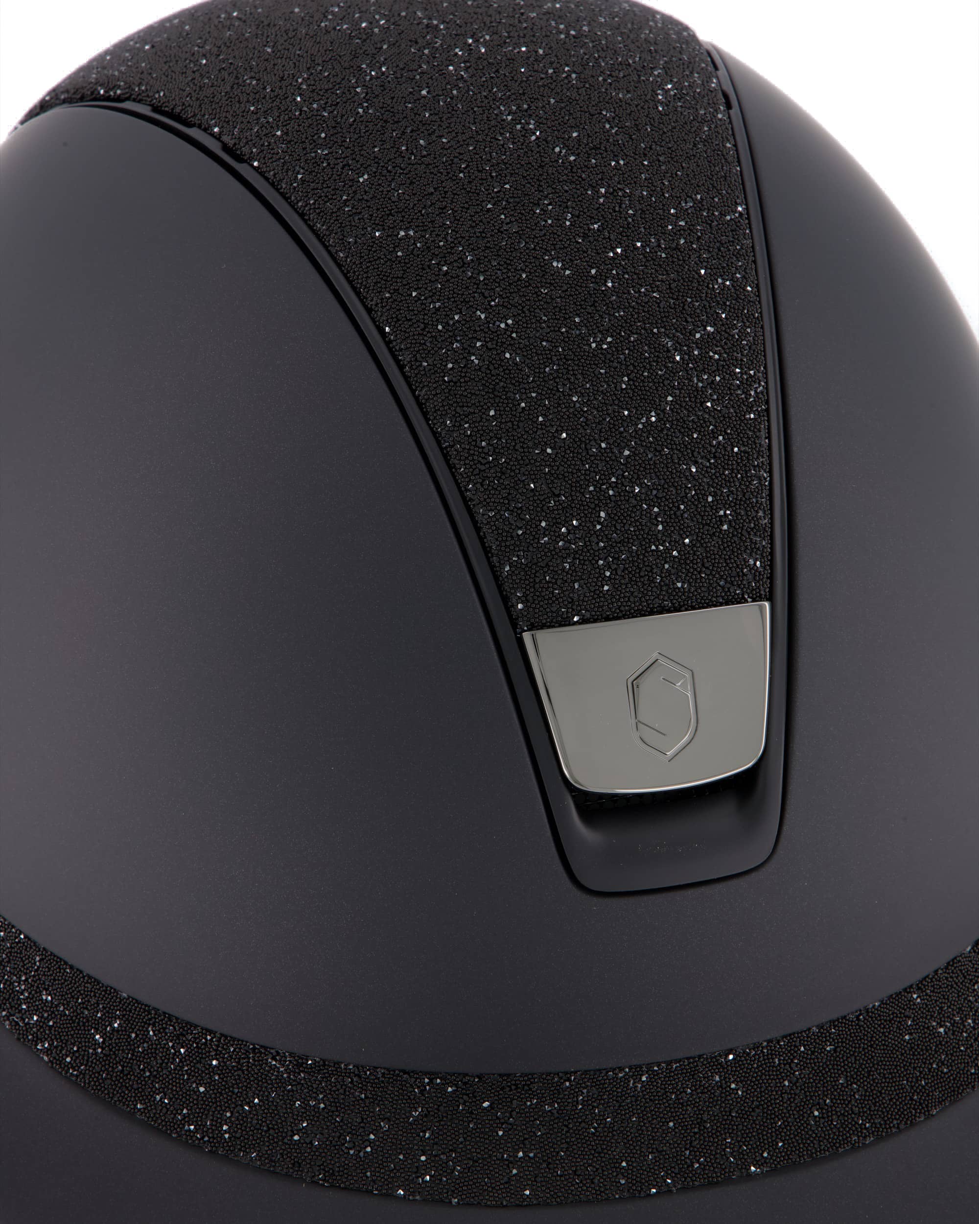 Riding helmet Miss Shield Shadowmatt, Top Crystal Fabric Swarovski Black, Frontal Band Crystal Fabric Swarovski Black, Trim Matt Black, Blason Chrome Black in black
