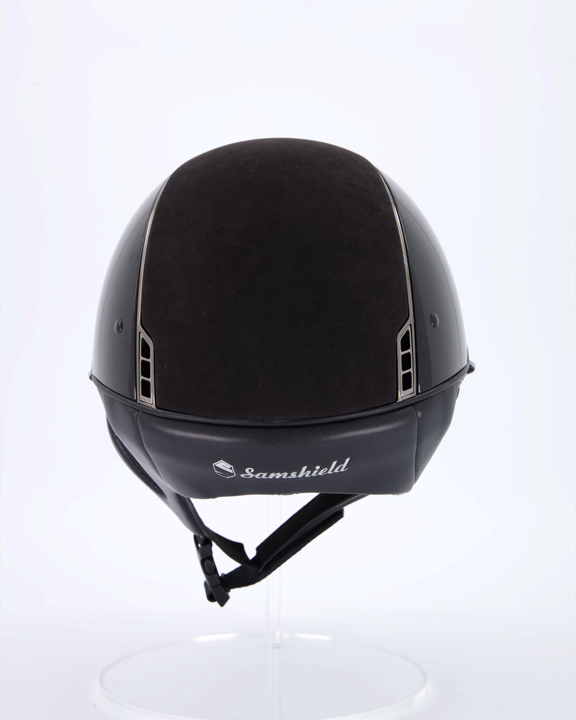 Riding helmet Miss Shield Shadowglossy Black, Top and frontal band Alcantara Black, Trim Matt Black, Blason Chrome Black, 5 Swarovski stones Black