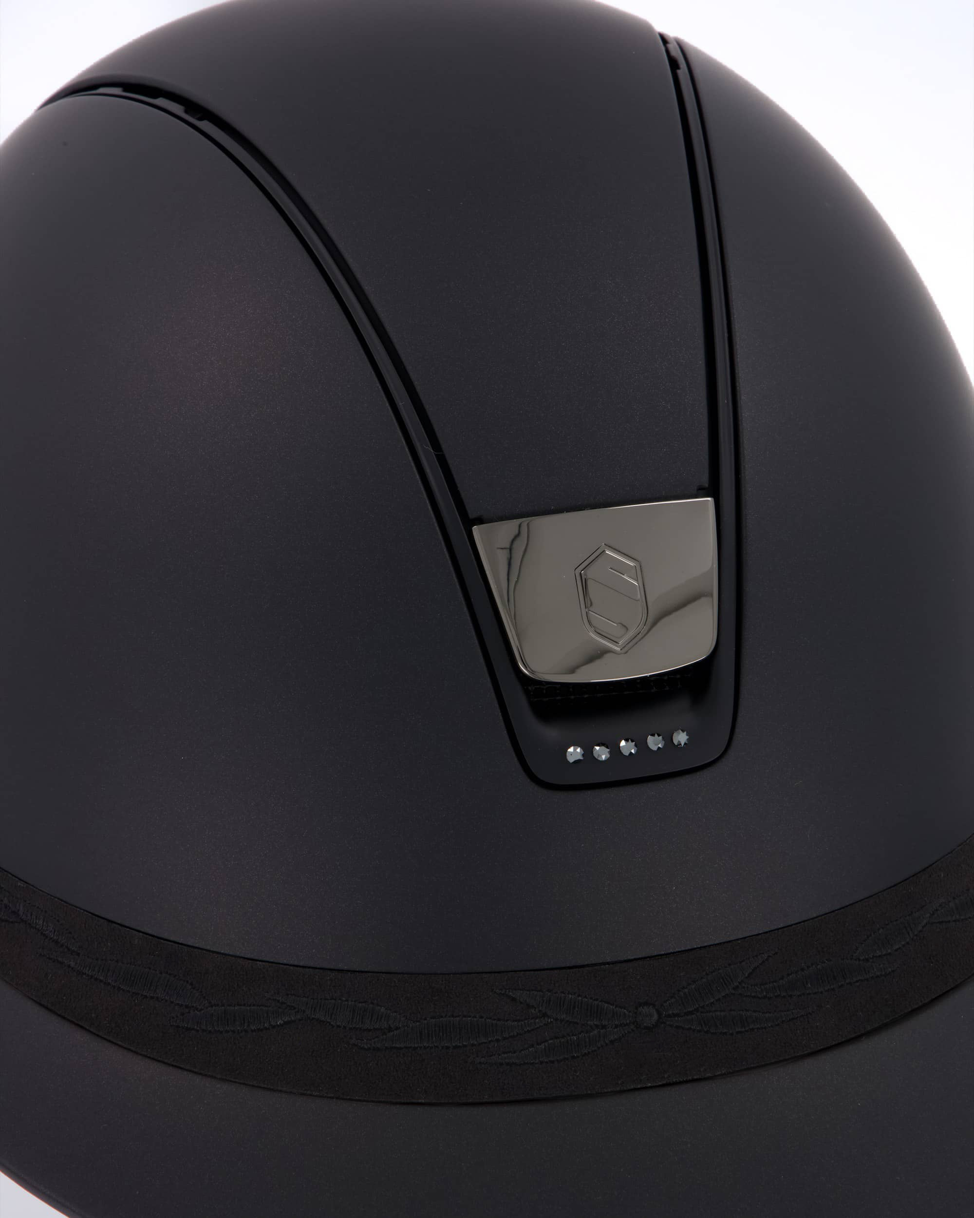 Riding helmet Miss Shield Shadowmatt Black, Top Shadowmatt Black, Frontal Band Flower Embroidery Black, Trim Matt Black, 5 Swarovski Jet Hemitate, Blason Chrome Black